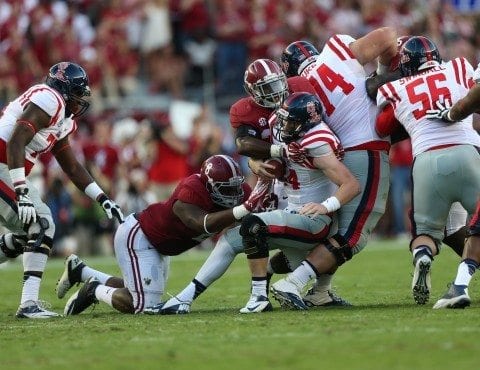Alabama football players Jeoffrey Pagan and CJ Mosley wrap up the Ole Miss offense.