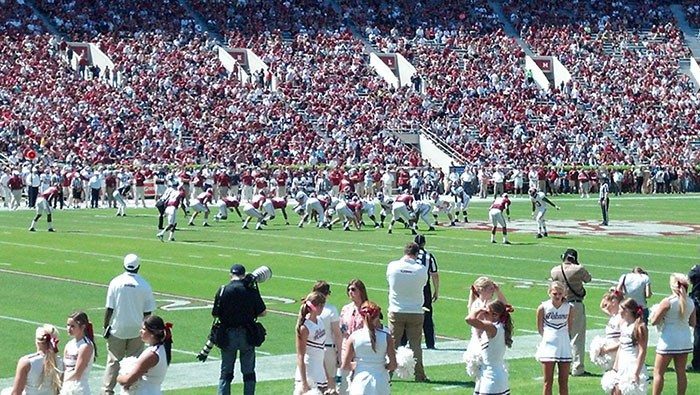 Players wear crimson and white jerseys in the intersquad scrimmage that proves Alabama should cancel its upcoming football season.